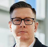 Alexander Hughes, chief executive at a cryptocurrency trading company, headshot.