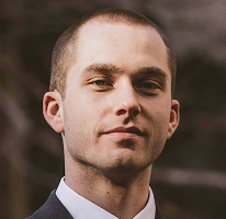 Thomas Whitfield, trading analyst at a cryptocurrency market firm, headshot.